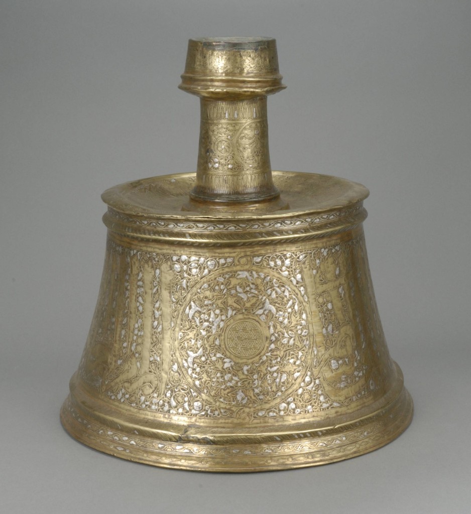 Candlestick, Egypt or Syria, 14th century. Brass inlaid with silver, made for an officer of al-Malik al-Nasir. The al-Sabah Collection, Dar al-Athar al-Islamiyyah, Kuwait