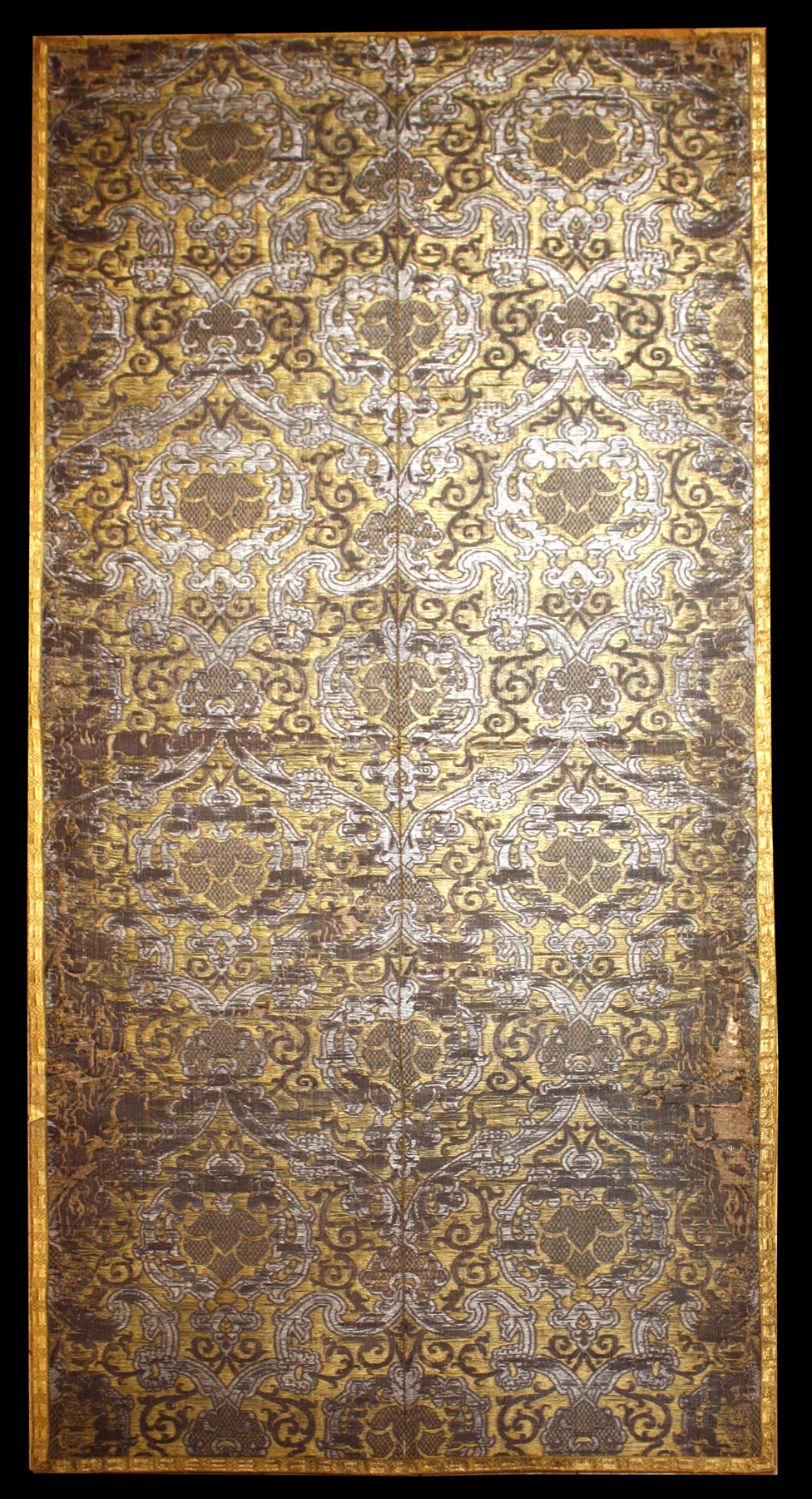 Italian Brocatelle, circa 1550, with a design of arabesques, entwining stems and vegetal ornament woven in silver metal thread and silk on a rich yellow silk ground. Joanna Booth, London