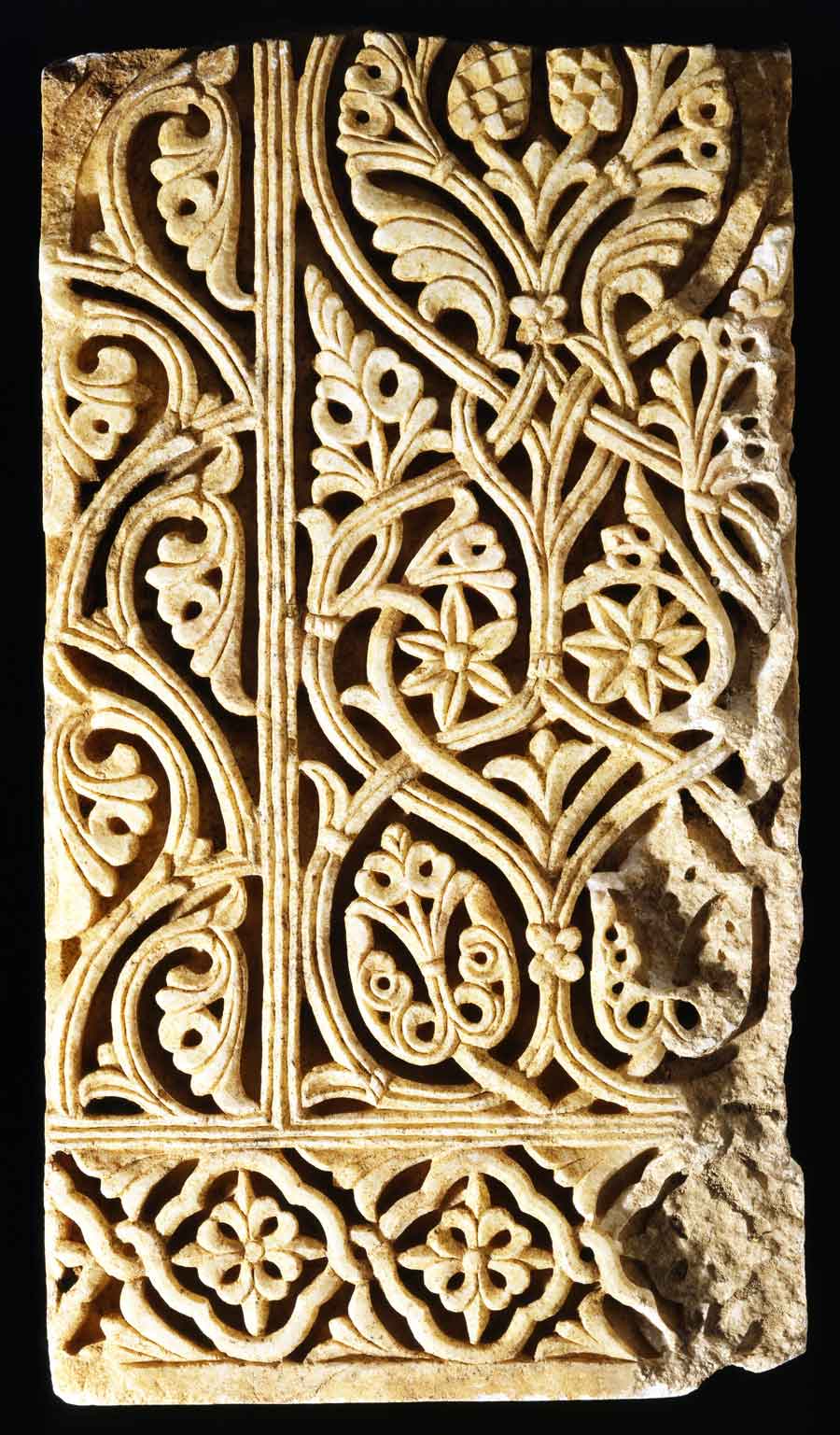 Marble relief, Spain, Cordoba; 2nd half of 10th century The Spanish Umayyad dynasty, descended from the Syrian Umayyad caliphs, remained truer to the styles of Antiquity than the Abbasid caliphs in Baghdad. The Spanish Umayyads reached their zenith in the 10th century, when Cordoba and the palace city of Madinat al-Zahra were decorated magnificently. Innumerable capitals and reliefs like this one were created in a style that clearly originated in Antiquity yet heralded a new idiom. The tendency was the same throughout the Islamic world. The acanthus and vines of Antiquity were stylized and denaturalized, and symmetry triumphed at the expense of natural growth. This relief shows an incipient arabesque that in time would be further developed.