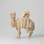 Statuette of a camel and rider Mesopotamia or the Levant, 8th or 9th century; ivory, carved, with some traces of black pigment, 25 x 23.5 x 12 cm