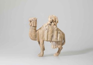 Statuette of a camel and rider Mesopotamia or the Levant, 8th or 9th century; ivory, carved, with some traces of black pigment, 25 x 23.5 x 12 cm