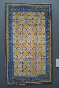 This carpet would have been used to cover the raised heated platform, the lang, upon which a scholar or important person would sit. The yellow dye would have be red when dyed originally but has since faded. Kang carpet, Ningxia, northwest China, ca. 1700.