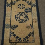 Lot 858, Chinese mat, late 19th c., 2 ft. 11 in. x 1 ft. 6 in. Estimate $300-500