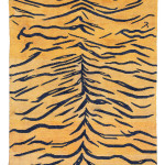 Lot 14 A TIGER RUG TIBET, LATE 19TH CENTURY 4ft.11in. x 2ft.10in. (150cm. x 86cm.) £3,000-5,000