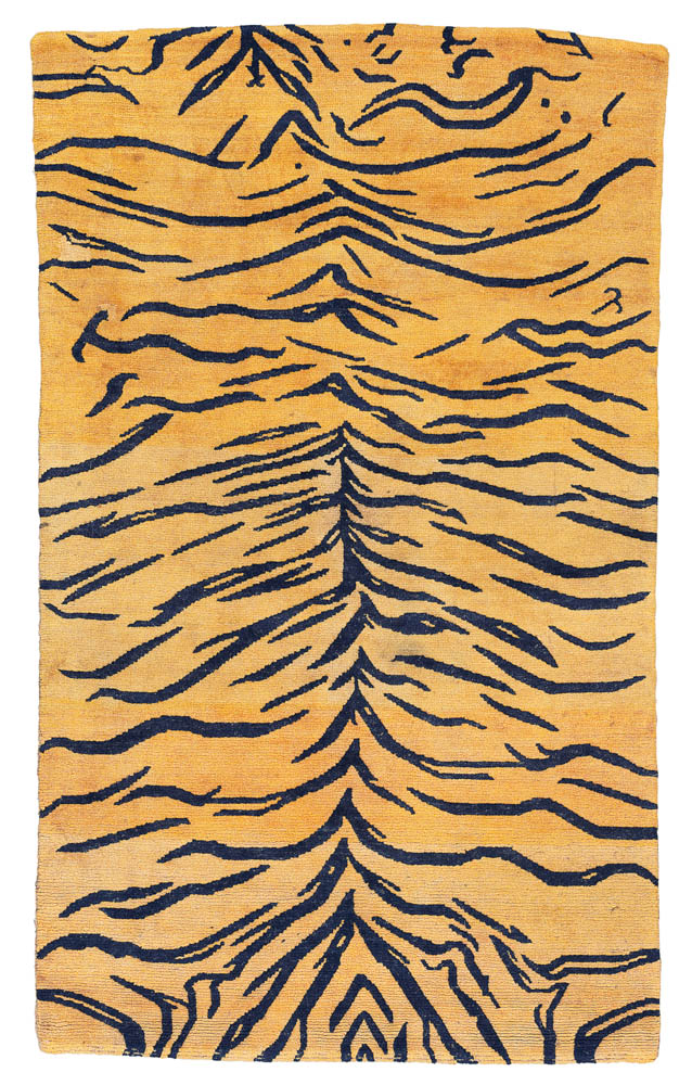 Lot 14 A TIGER RUG TIBET, LATE 19TH CENTURY 4ft.11in. x 2ft.10in. (150cm. x 86cm.) £3,000-5,000