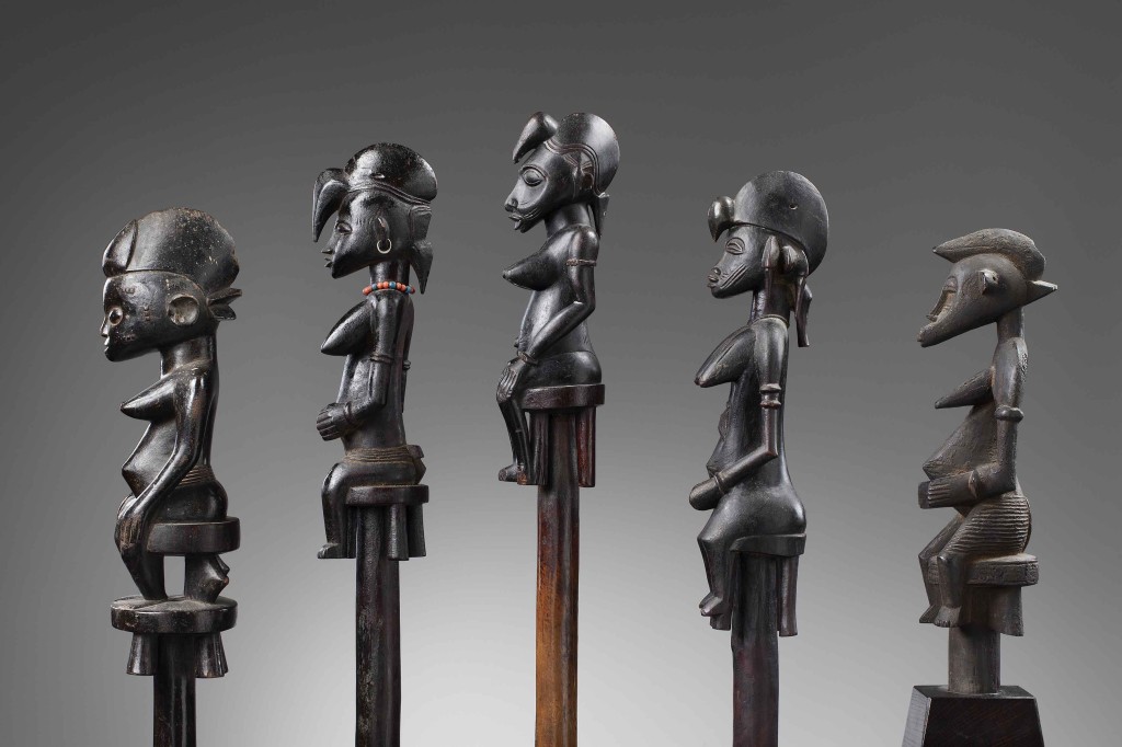 Bernard-de-Grunne,-African-Masters,-Serie-of-Senufo-ceremonial-staff-5.-Senufo-ceremonial-staff-Wood,-total-height--141,5-cm,-height-statue--35,2-cm,-Republic-of-Ivory-coast-