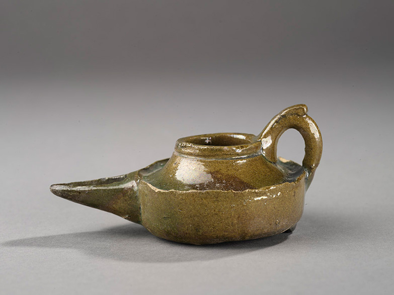 Saucer lamp, Earthenware, thrown, modeled and glazed, Egypt, 12th century