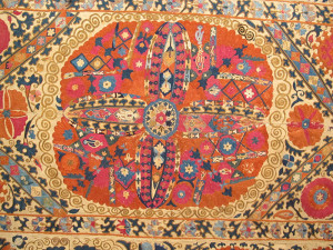 Large medallion suzani (detail) , Uzbekistan, early 19th century, Vok Collection at Rippon Boswell Wiesbaden, HALI at Olympia