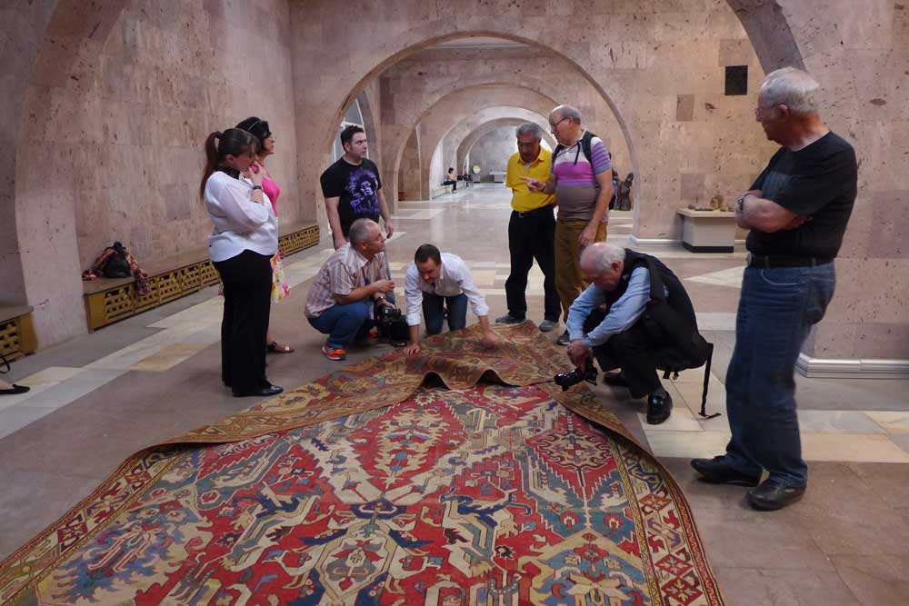 The HALI Tour get a close look at a 17th century Dragon rug, Museum of Sardarapat, Armenia