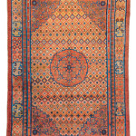 Khotan Silk, Eastern Turkestan, first half 19th century. 270 x 184 cm (8ft. 10in. x 6ft.; Warp: silk, weft: silk, pile: silk. Lot: 147, Austrian Auctions, Vienna, 22 April, Lot: 212,Estimate: € 30.000 – 40.000. This silk carpet has a certain Tibetan feel to it. Although it probably was not made in Tibet it may have been intended for export to the region but made in one of the neighbouring carpet producing centres in the oasis towns of eastern-Turkestan in the north or Gansu province in the east. The use of silk and its structure point towards Yarkand or Khotan while the design of the rug and the colours point more towards Gansu. The main border, the ‘Buddhist pearl’ minor border and the field show strong links to China, while the reciprocal other minor border is typical for Gansu. Note also that the ‘endless knot’ symbols in the corner of the same border. Only the decoration in the medallion and the corners could be considered to be east-Turkestan motives; the lack of any of the golden yellow typical of the region and the use of a different shade of red would further the argument that this is in fact a rug made in the Gansu. That having been said, Hans König noted in his seminal article about Gansu carpets in Hali 128 that he didn’t know any silk rugs from the area.