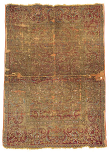 Cairo Fragment, Egypt, 16th century, 177 x 126 cm (5ft. 10in. x 4ft. 2in.); Condition: fragment, several repairs and age-related signs of use; warp: wool, weft: wool, pile: wool. Lot: 147, Austrian Auctions, Vienna, 22 April, Estimate: € 8.000 – 12.000. The rugs made the territories belonging to the Mamluk sultans have a number of special features, technical and aesthetic, that set them apart from all other carpets made in the 16th-17th centuries. The threads out of which all textiles and carpets are made were spun together in the other direction in Egypt than in all other countries: S-spun and Z-plied. There are inventory records showing that mention Cairene carpets in European inventories in the 16th and 17th centuries. The Ottomans captured the Mamluk domains in 1517 and it is the Ottoman design repertoire that is depicted in this rug, which woven on wool and without any silk probably dates to the late 16th century. The ground is typically dyed with insect dyes, either lac similar to Mamluk rugs or cochineal as is seen here. These dyes tend to have a corrosive effect on the wool. The variety of colours on this fragment are more apparent than on many fragments and the design represents the full transition to floral motifs from geometric.