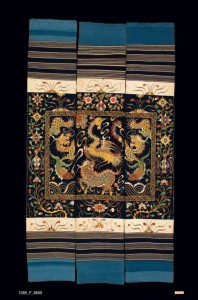 Hanging, China Li, Early 20th-Mid 20th Century. 7' 1" x 4' 1" (215.9 x 124.5cm); Cotton, silk thread; embroidery. Wall hanging composed of three large cotton panels with striped patterns on ends. Embroidered in the center section with dragon, fish, phoenix, and dog patterns, with a Chinese key small border and wider outer border of floral and vase designs. Roger Hollander Collection - Primary collection