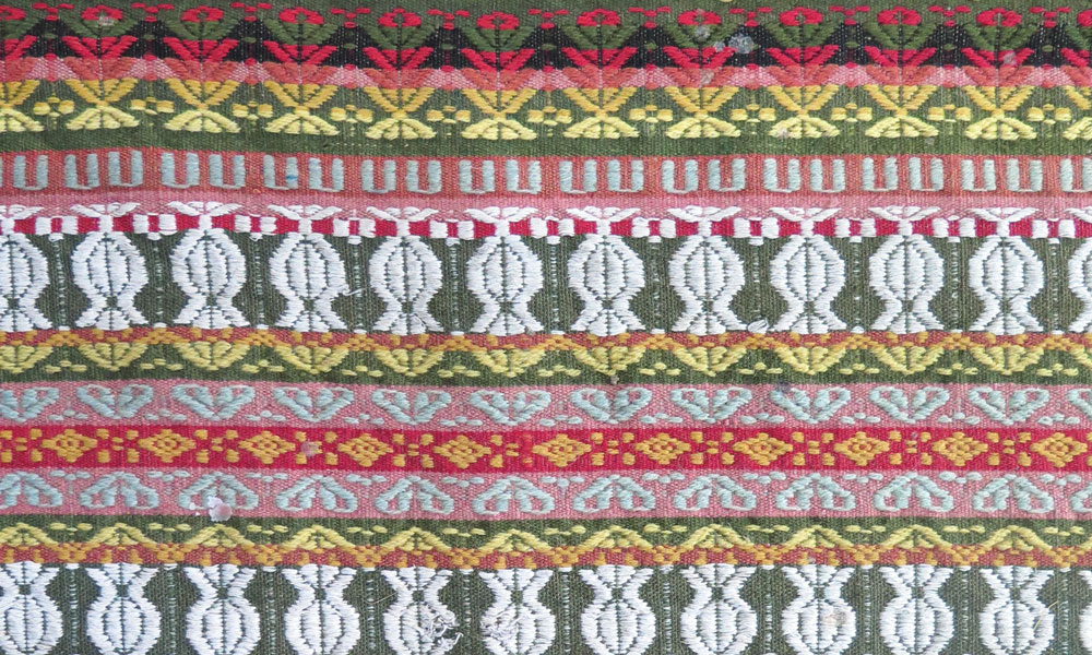 Defregger carpet (detail) from San Sigismondo, Val Pusteria, South Tyrol, first half 19th century. Linen warps, naturally dyed woollen brocading, 0.55 x 2.80 m (1' 10" x 9' 2"). San Sigismondo Parish Collection