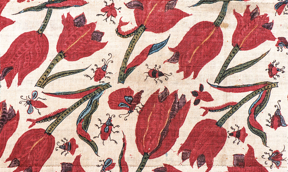 Chintz fragment with tulips and insects (reportedly found in Japan), Coromandel Coast, India, ca.1700-30. 0.13 x 0.20 m (5" x 8"). Hand-drawn on cotton cloth using dyes, mordants and resists. Karun Thakar Collection