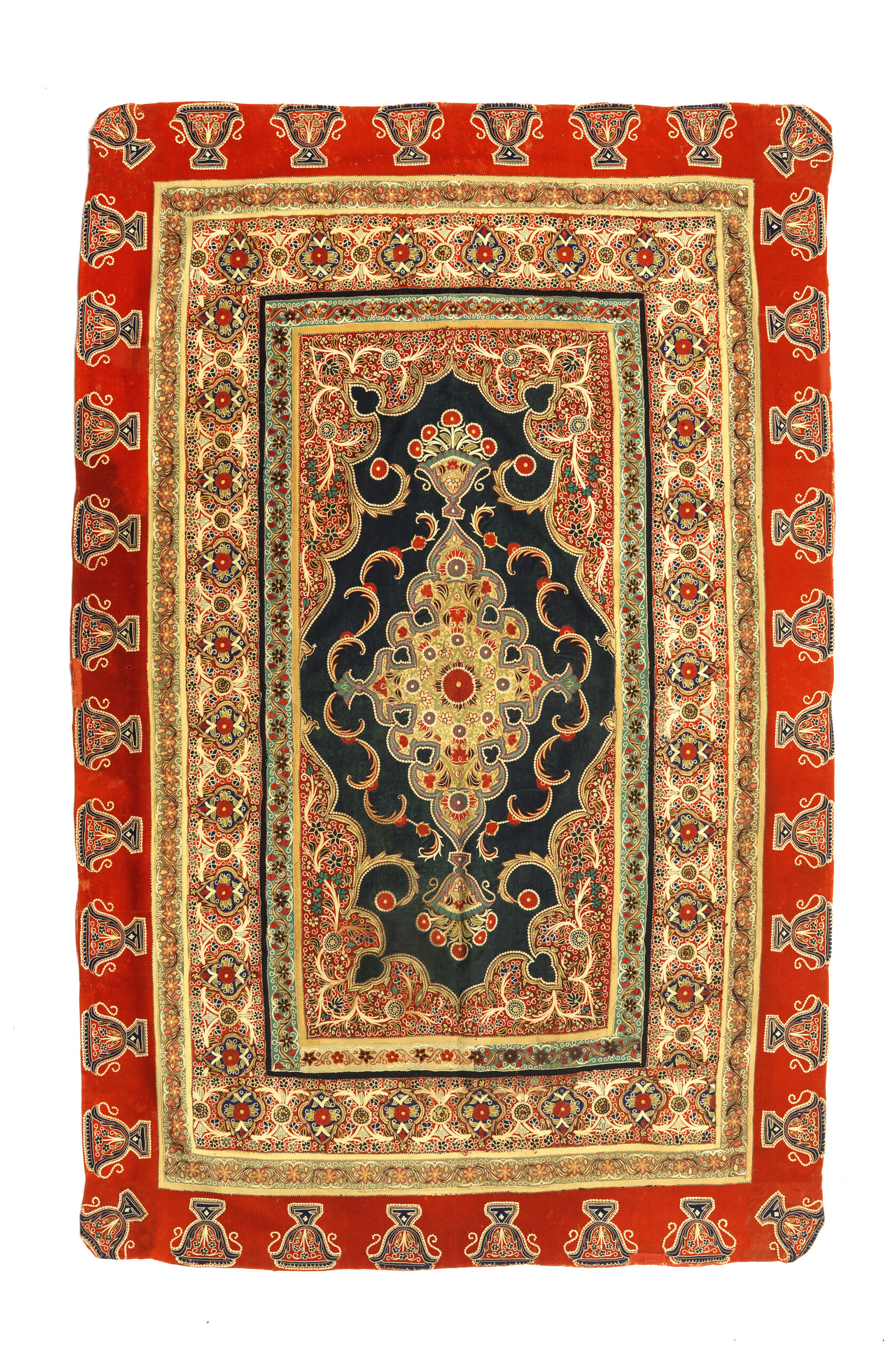 4 Cover, Rasht, late 19th century. Rasht-duzi patchwork, red, blue and yellow wool flannel embroidered in fine stitches with flower and foliage medallions and borders