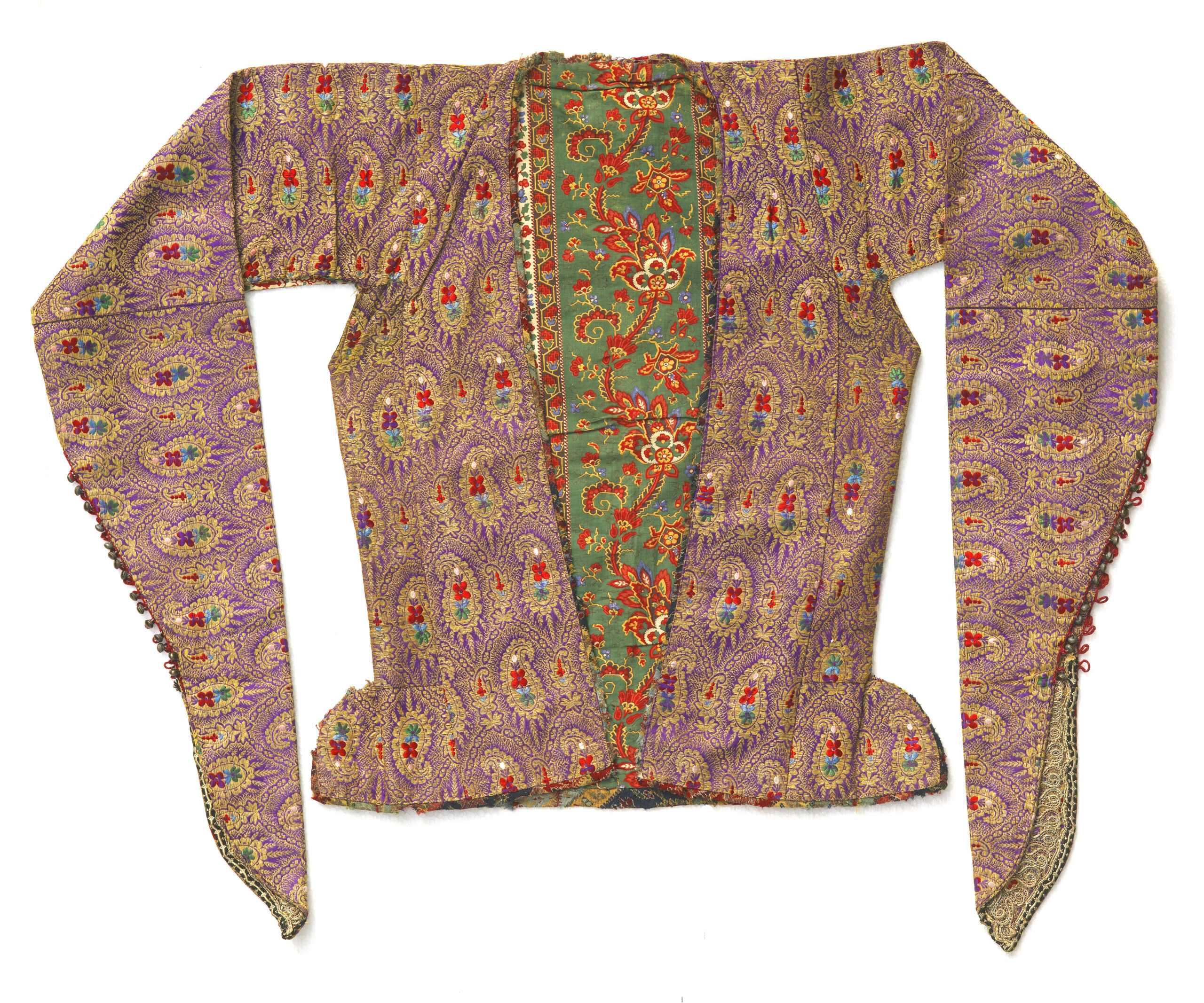 1 Woman’s jacket, Esfahan, Iran, mid-19th century. Zarbaft silk woven with a design of repeated boteh motifs and a printed cotton lining imported from Russia or England. Silk, gold thread, sleeve ends with tiny buttons, trimmed with gold lace. All images, The Ramezani Family Collection